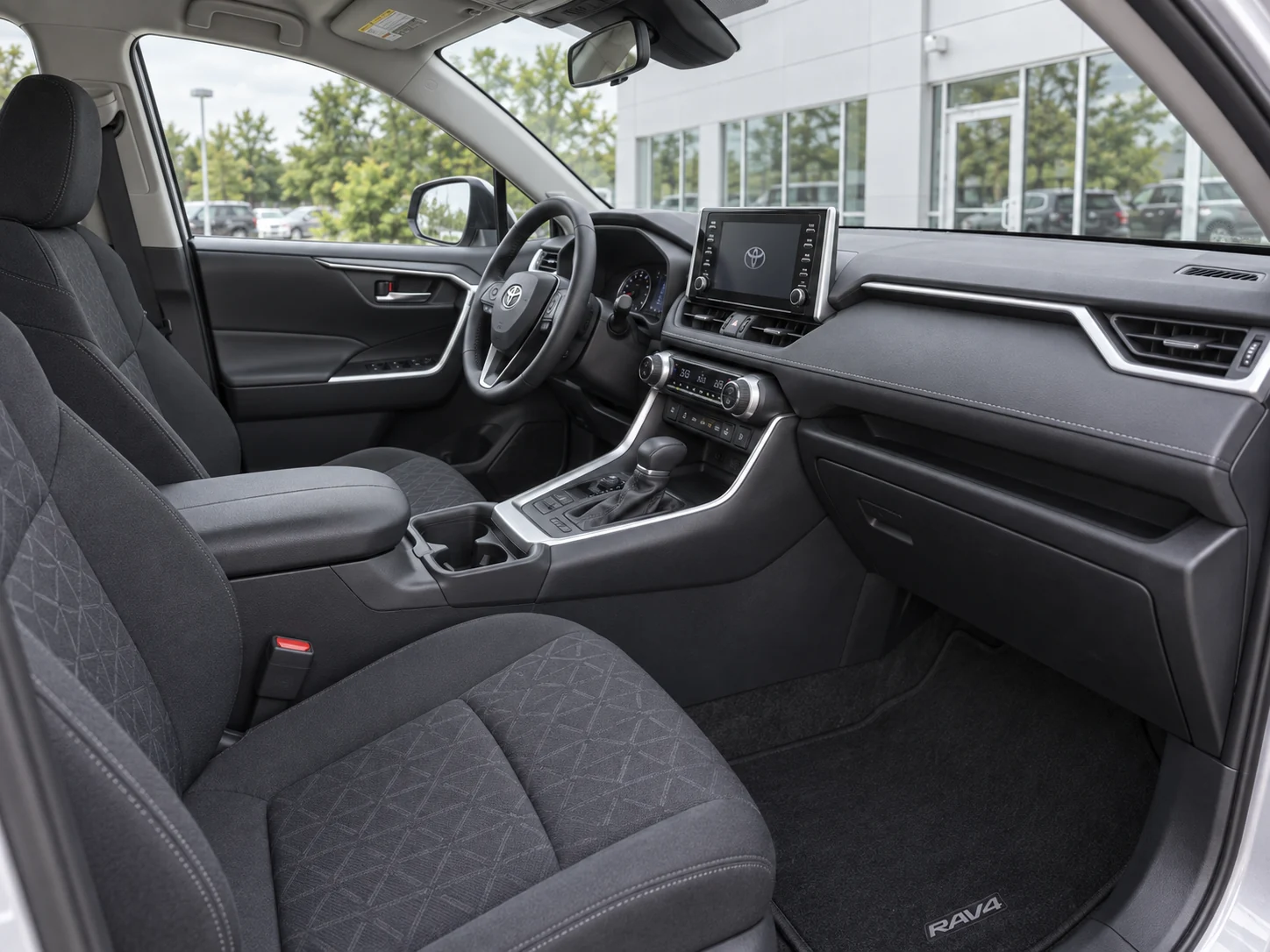 Illustrative dashboard and front seats in the Toyota RAV4 demo